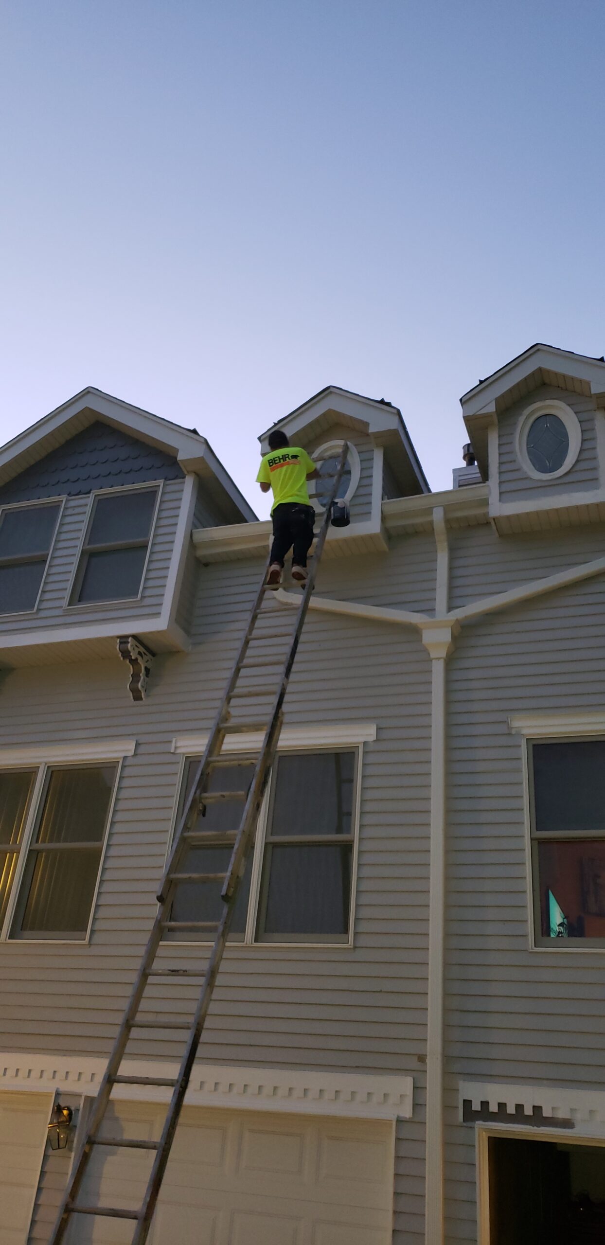 Contractor painting a townhome